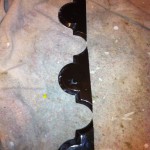 Cut pieces of beveled arabesque tile to start the next corner