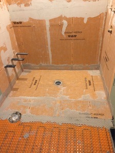 Heated shower floor