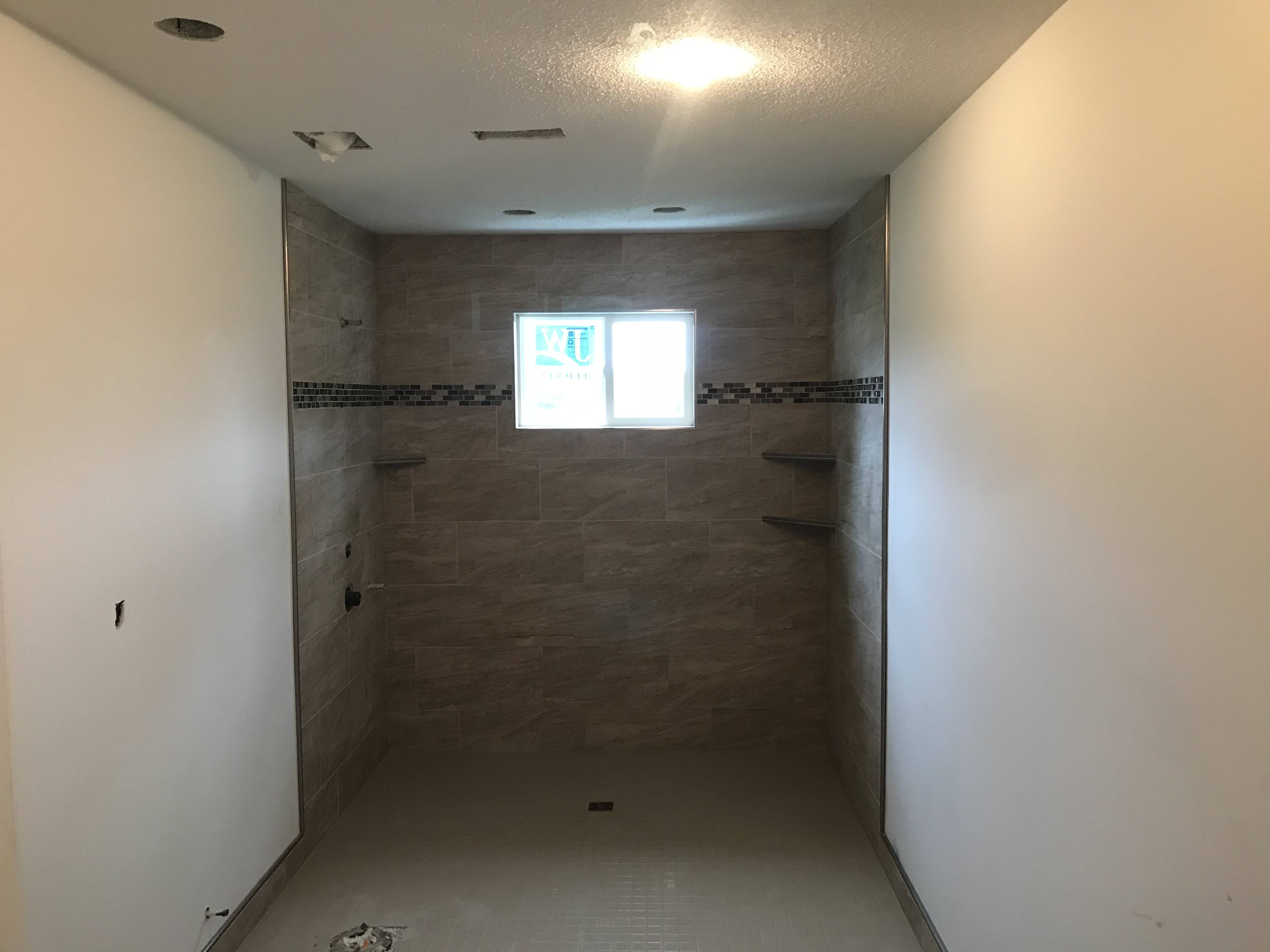 IMG_5885 custom tile shower with no curb. This curbless tile shower makes accessibility a breeze.